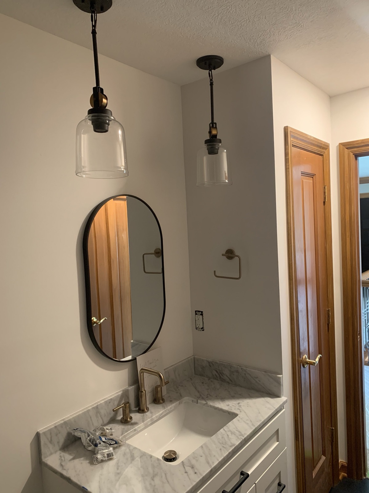 Pendant lights installed over a bathroom vanity